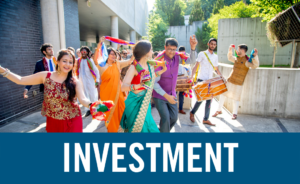 picture of an Indian wedding in the sculpture garden with the word "investment" on it