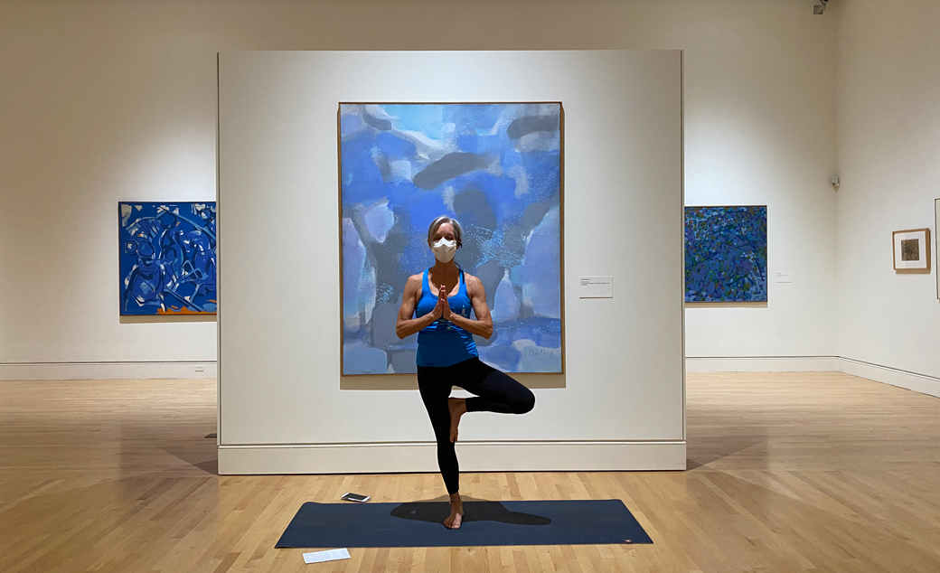 a woman teaching yoga in the Carl Holty exhibition