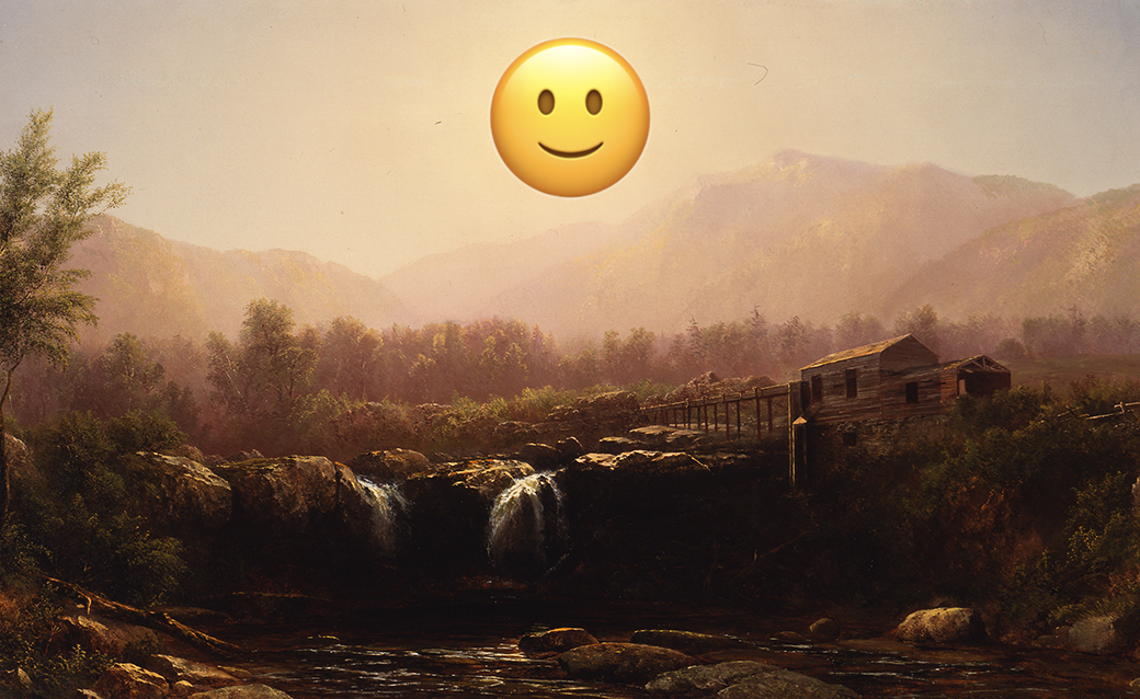 a smiley face emoji on top of a landscape