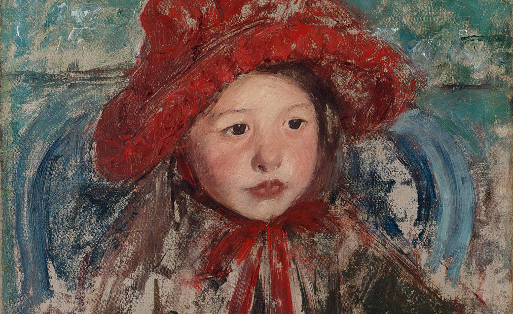 a detail of a painting of a small girl in a red hat by Mary Cassatt
