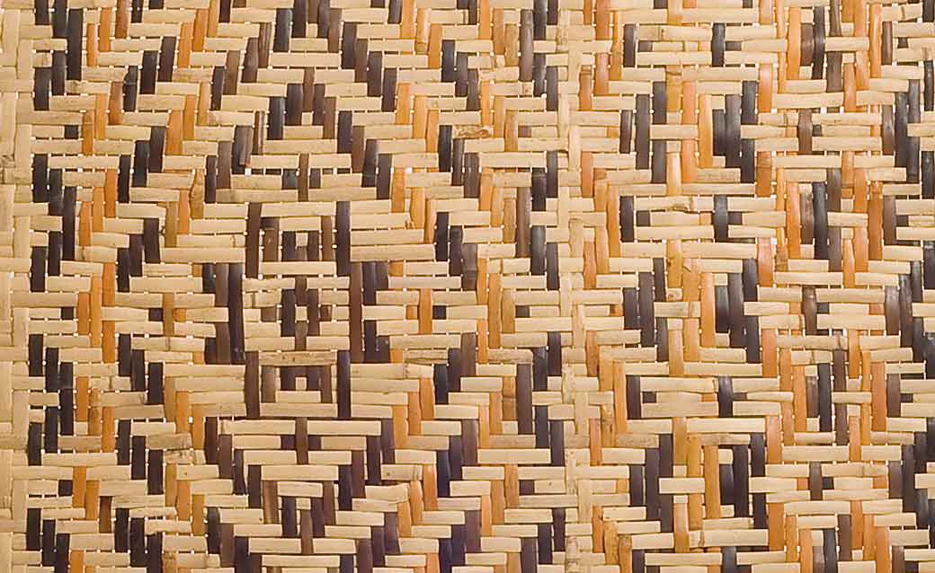 a detail of a woven Cherokee mat with star patterns