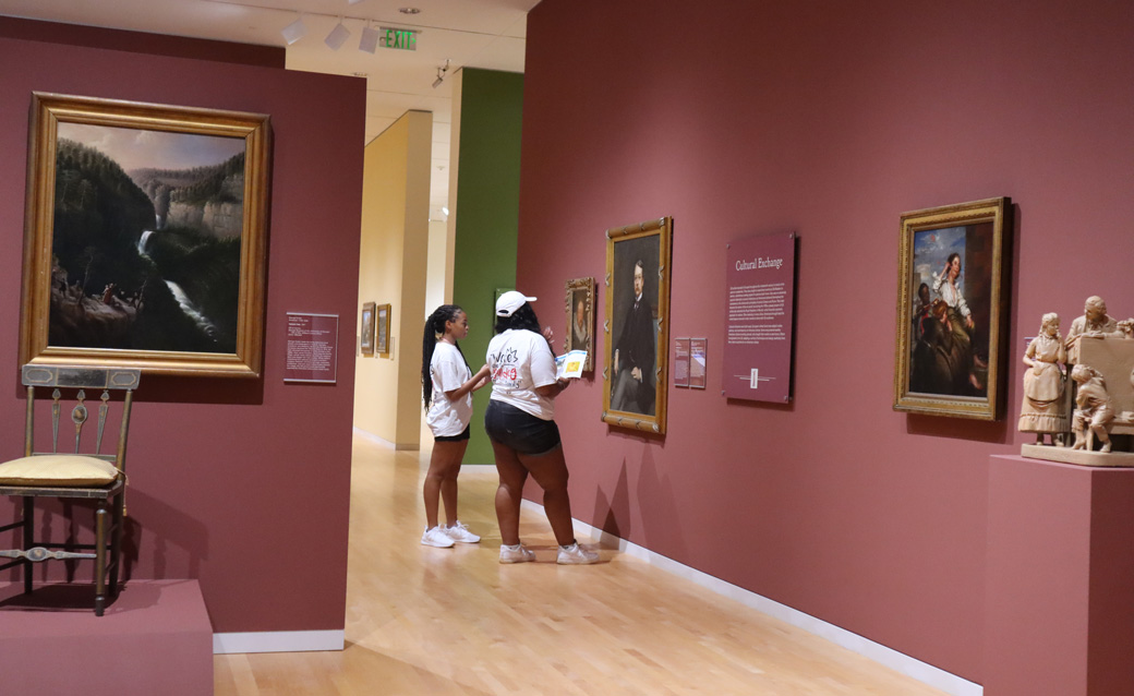students looking at art in the galleries