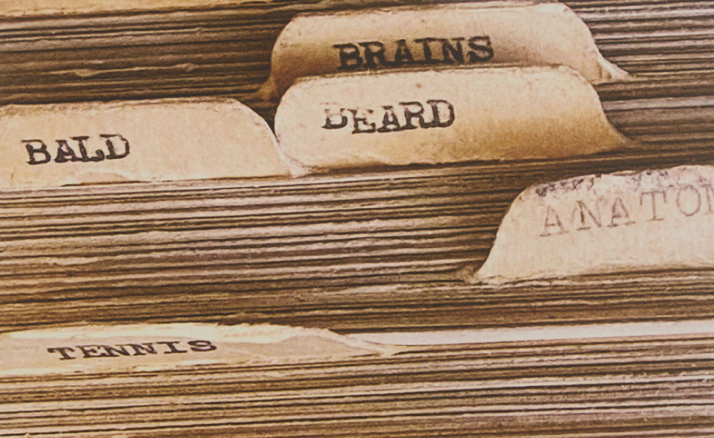 detail of a Richard Prince inkjet based on Milton Berle's joke file; it shows a close-up of index cards with dividers labeled things like "bald," "beard," "brains" and so on