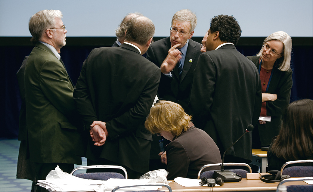 A group of diplomats, presumably discussing climate change, in a photo by Joel Sternfeld